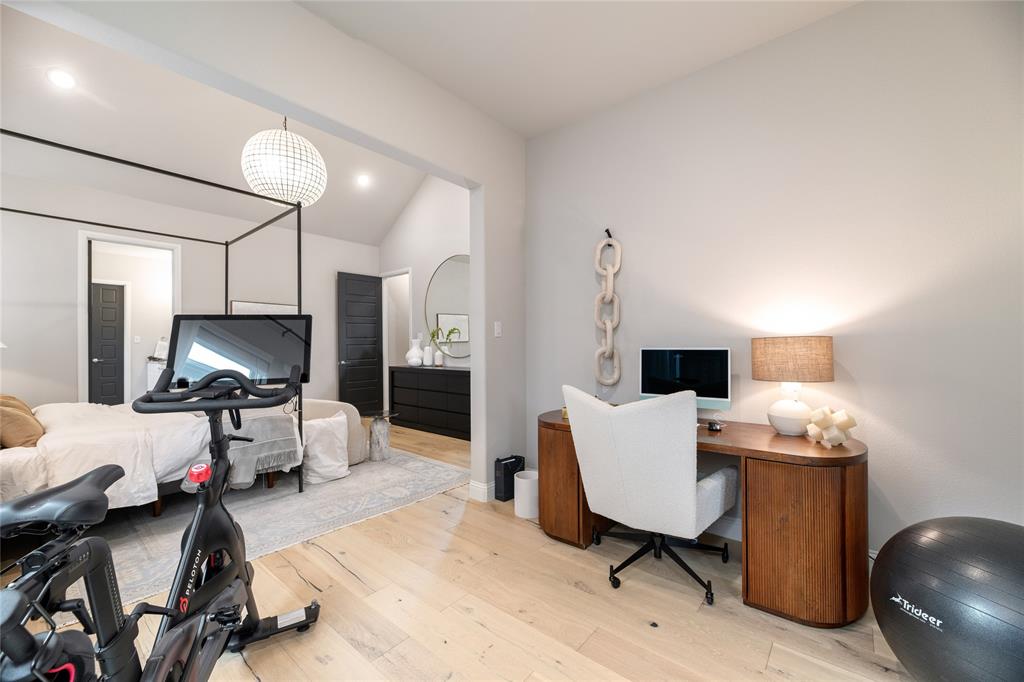 2262 Poppyvine Road Frisco, TX 75033 - Photo 19 of 40 This versatile room features light-toned hardwood flooring, a vaulted ceiling, and an open entryway to an additional room
