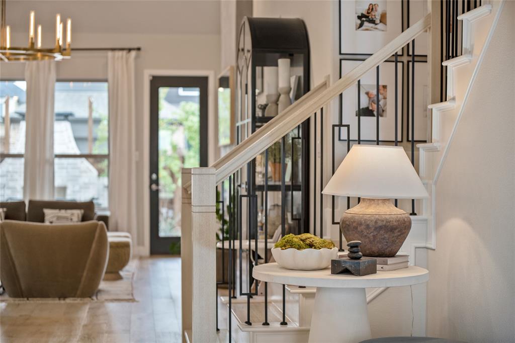 2262 Poppyvine Road Frisco, TX 75033 - Photo 23 of 40 The property features an open living area with hardwood flooring and a bright interior