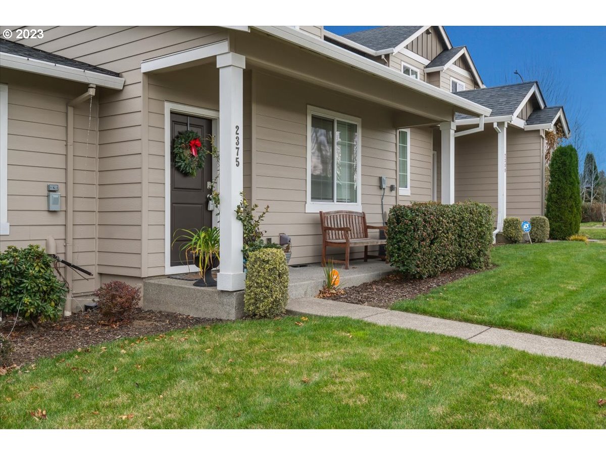2375 Southeast 16th Street Gresham, OR 97080 - Photo 1 of 28 a front view of a house with a garden