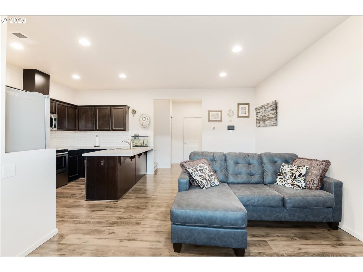 2375 Southeast 16th Street Gresham, OR 97080 - Photo 12 of 28 a living room with furniture and kitchen view