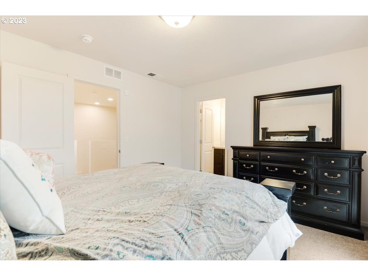 2375 Southeast 16th Street Gresham, OR 97080 - Photo 16 of 28 a bedroom with a bed and a flat screen tv
