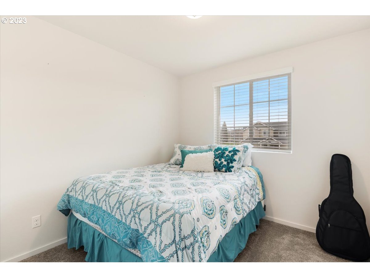 2375 Southeast 16th Street Gresham, OR 97080 - Photo 19 of 28 a bedroom with a bed and a window