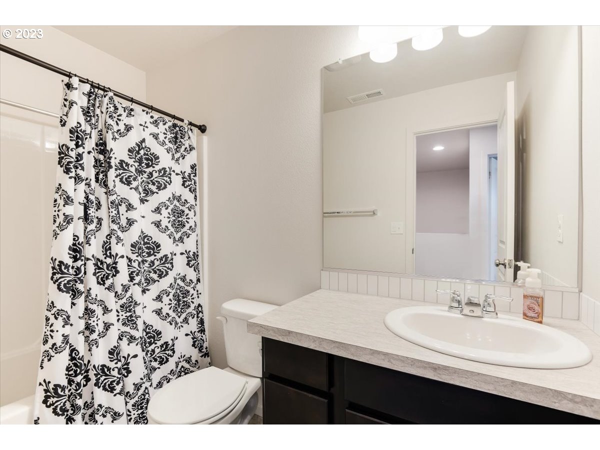 2375 Southeast 16th Street Gresham, OR 97080 - Photo 21 of 28 a bathroom with a sink vanity and a mirror