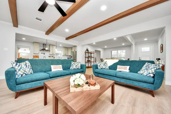 a living room with furniture and a large window