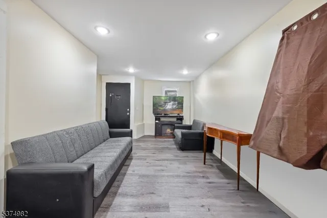 a view of a dining room with furniture and a window