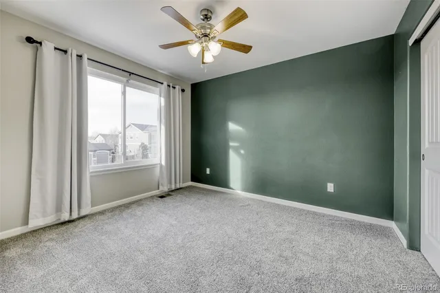 a view of a patio with a table and chairs