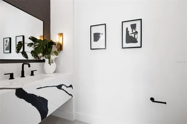 a bedroom with a bed and a potted plant