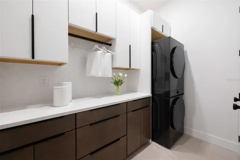 a kitchen with a sink and a refrigerator