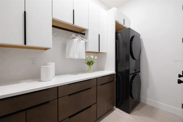 a kitchen with a sink and a refrigerator