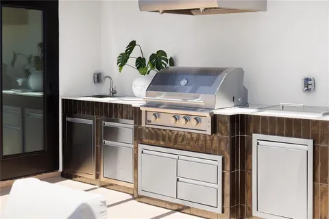 a kitchen with a stove and a refrigerator