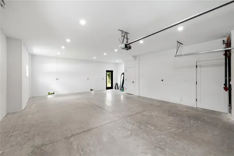 a view of a livingroom with a ceiling fan and window