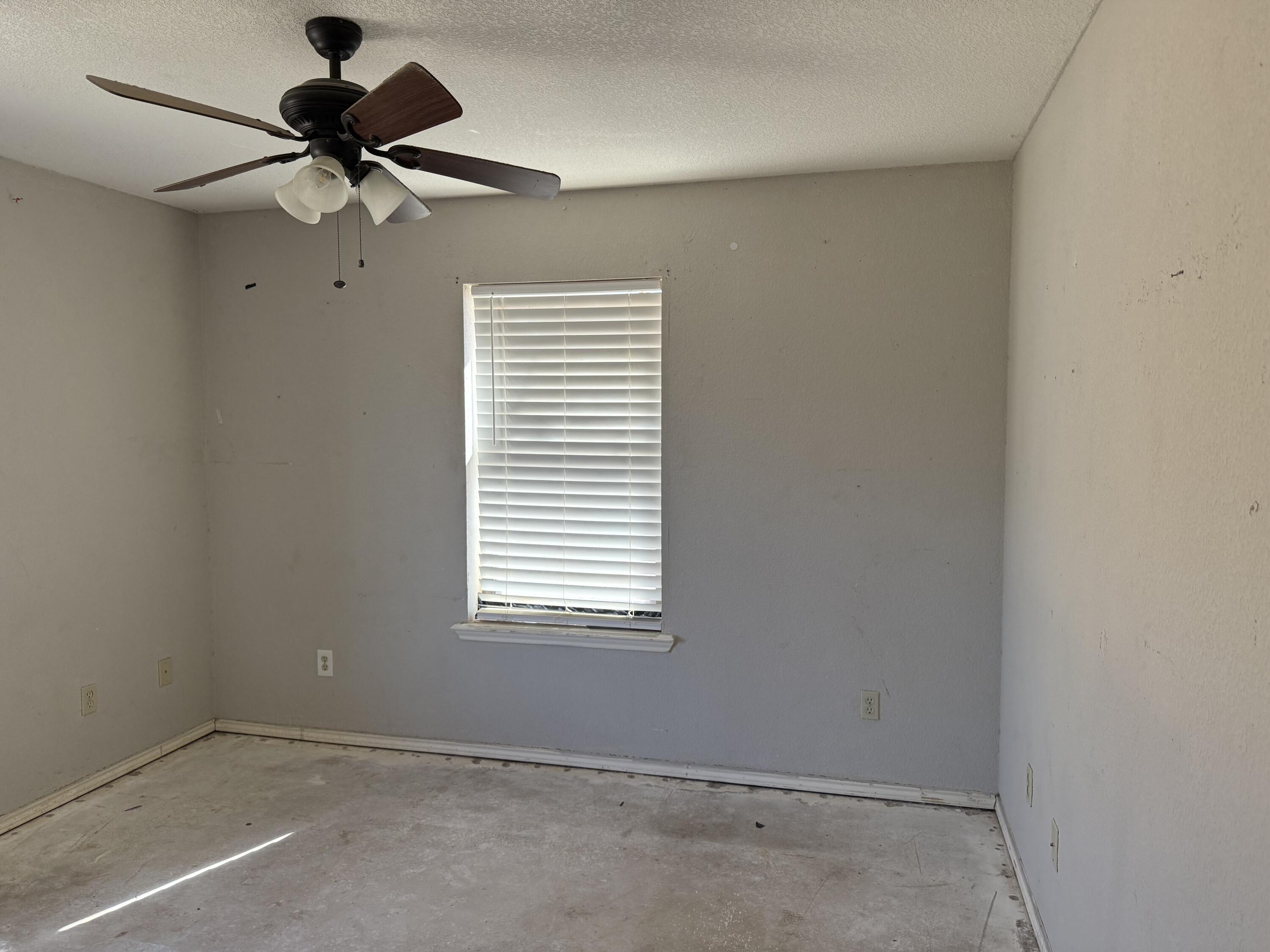 816 12th Street Wolfforth, TX 79382 - Photo 11 of 13 a view of an empty room with a window