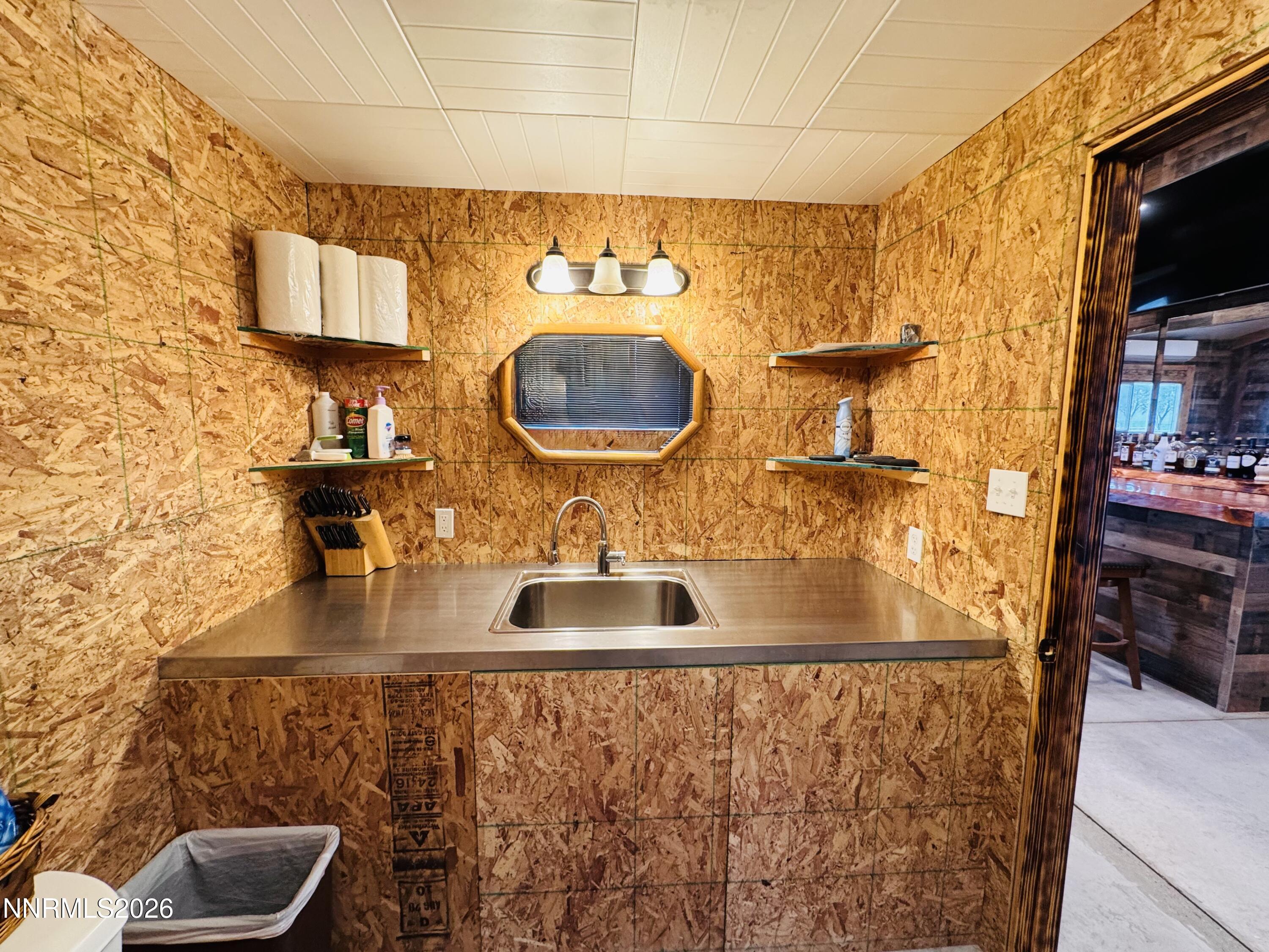 29400 Kings River Road Orovada, NV 89425 - Photo 40 of 40 a bathroom with a sink and a mirror
