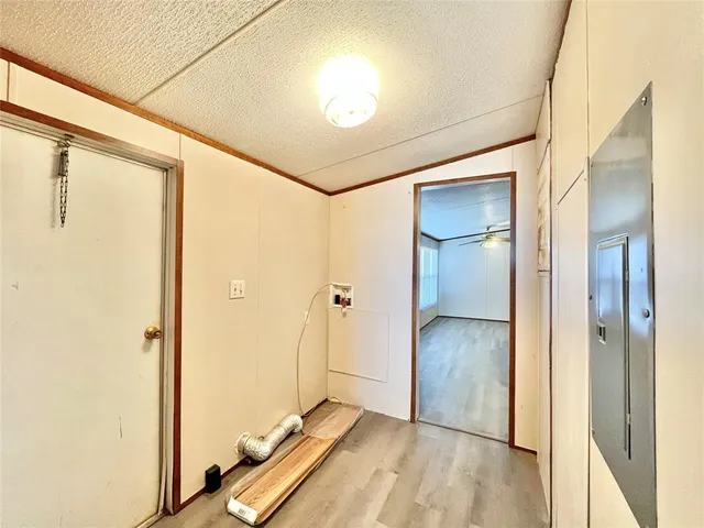 a view of a hallway with a large window