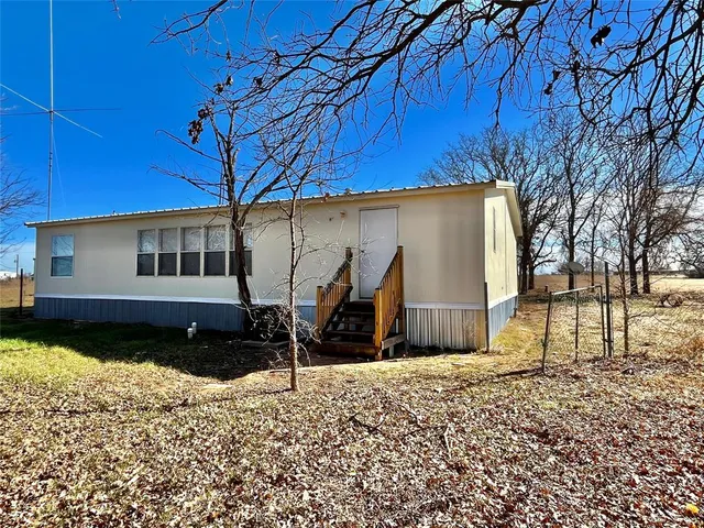 a house view with a backyard space
