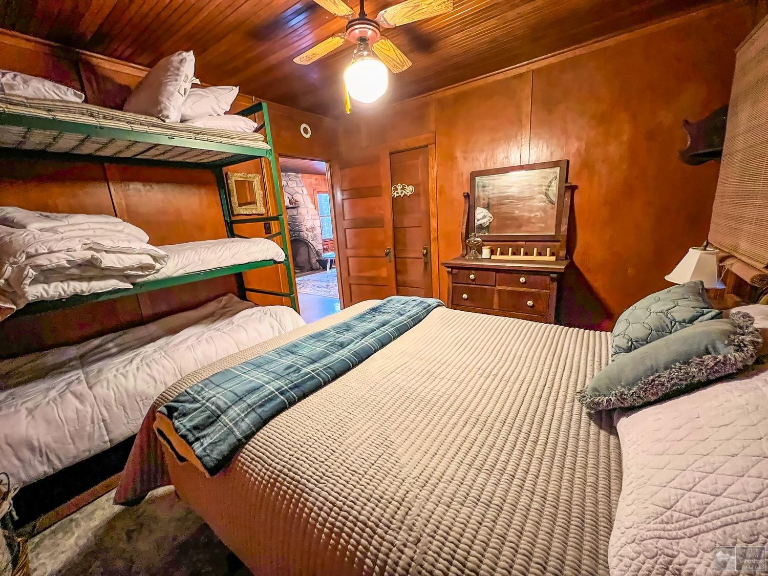 127 46 Milestone South Lake Tahoe, CA 95721 - Photo 12 of 22 a bedroom with a bed and wooden floor