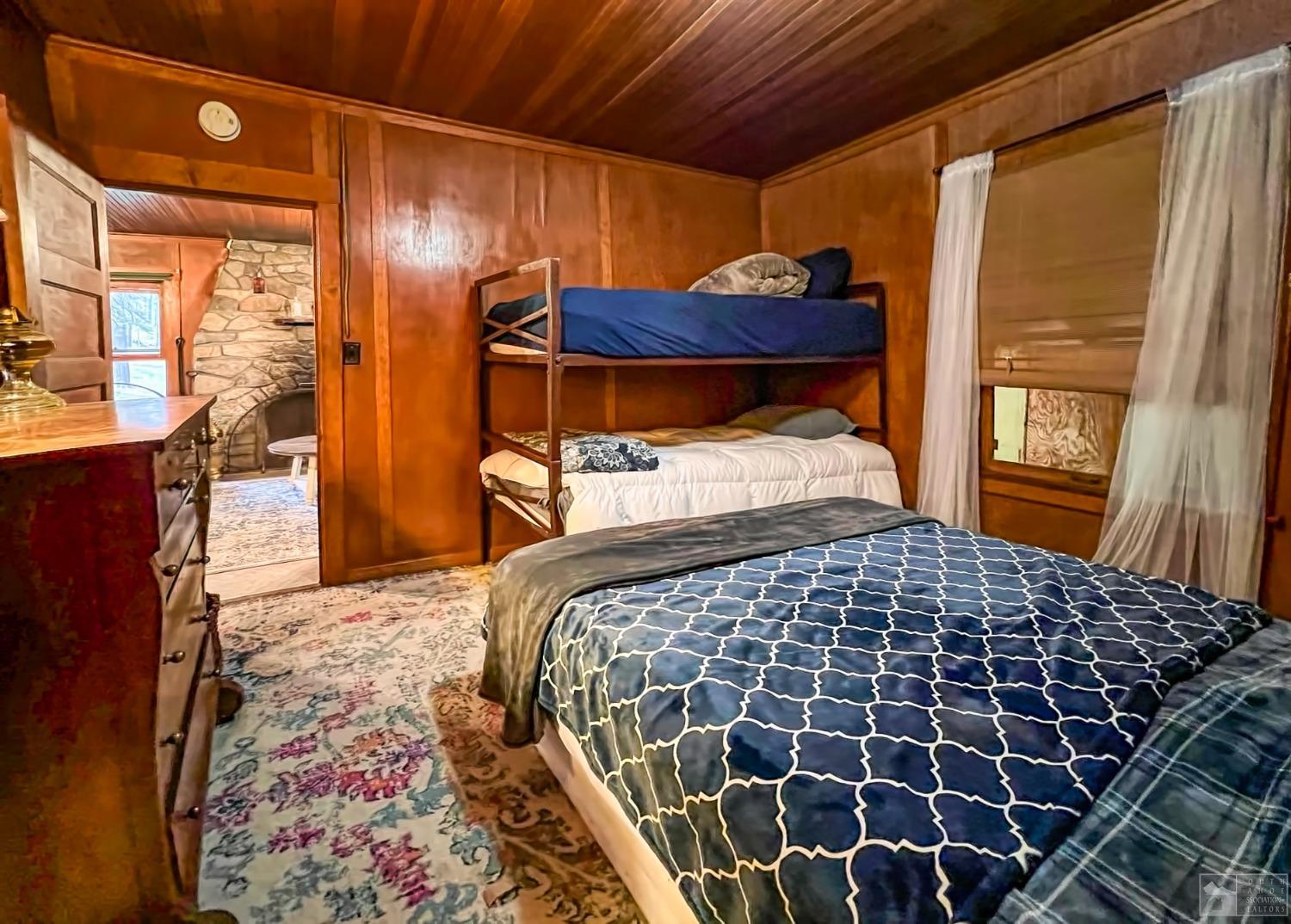 127 46 Milestone South Lake Tahoe, CA 95721 - Photo 15 of 22 a bedroom with a bed and wooden floor