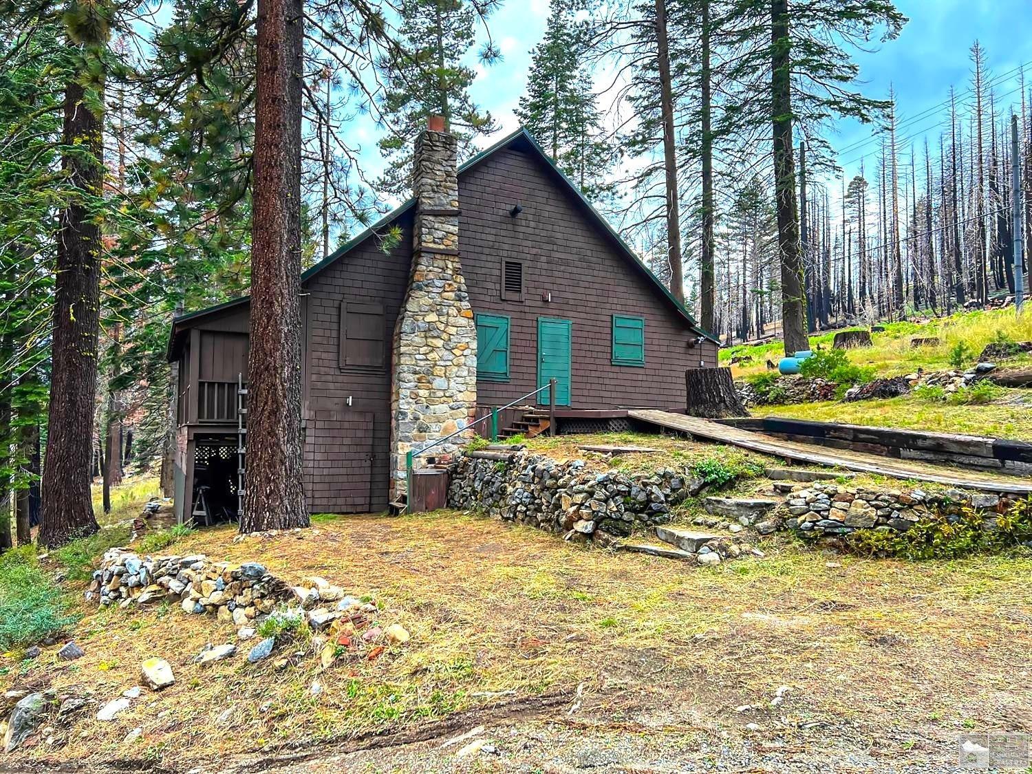 127 46 Milestone South Lake Tahoe, CA 95721 - Photo 22 of 22 a front view of a house with a garden