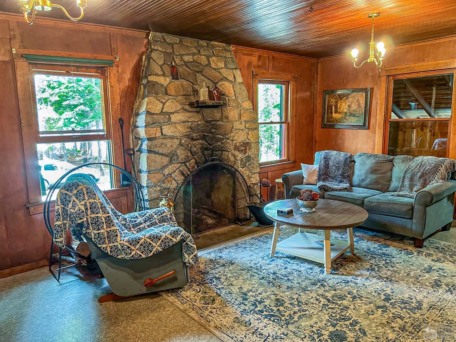 127 46 Milestone South Lake Tahoe, CA 95721 - Photo 6 of 22 a living room with furniture and a fireplace