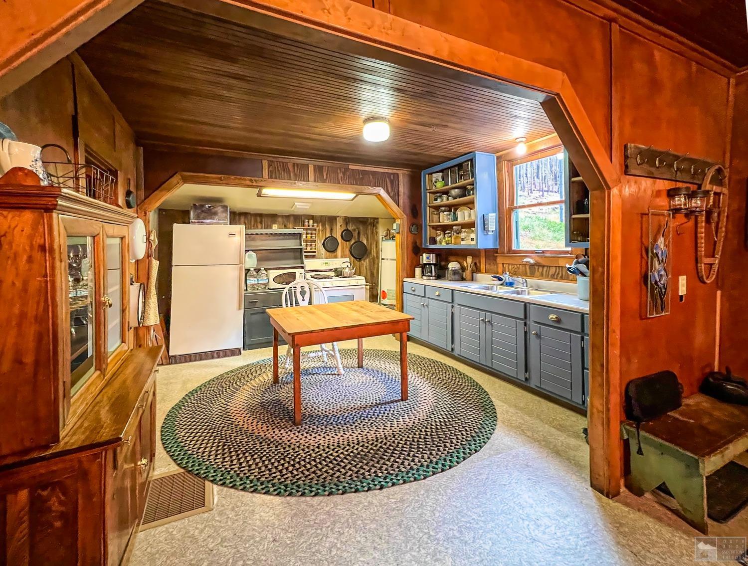 127 46 Milestone South Lake Tahoe, CA 95721 - Photo 7 of 22 a dining room with furniture and a rug