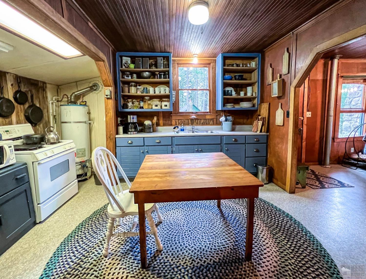 127 46 Milestone South Lake Tahoe, CA 95721 - Photo 8 of 22 a room with furniture a rug and wooden floor