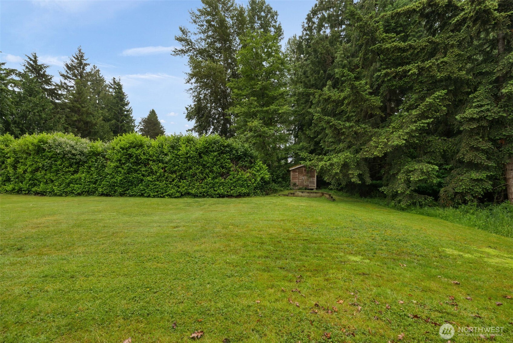 3560 Courtyard Lane Bremerton, WA 98310 - Photo 21 of 26 a view of a field with an trees