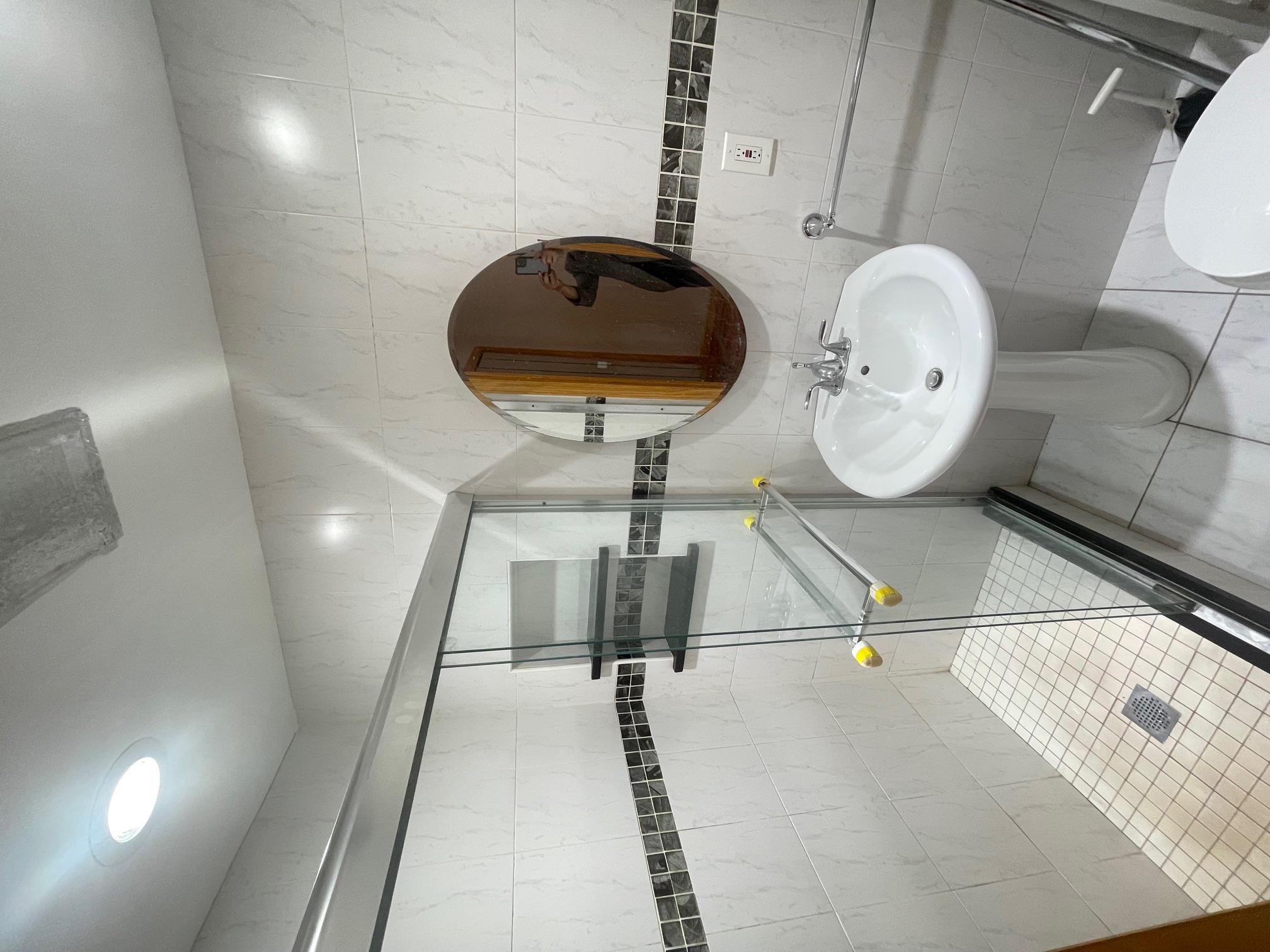 59-30 108th Street, Unit 2JJ Queens, NY 11368 - Photo 13 of 15 Full bath with a shower stall, marble finish flooring, and tile walls