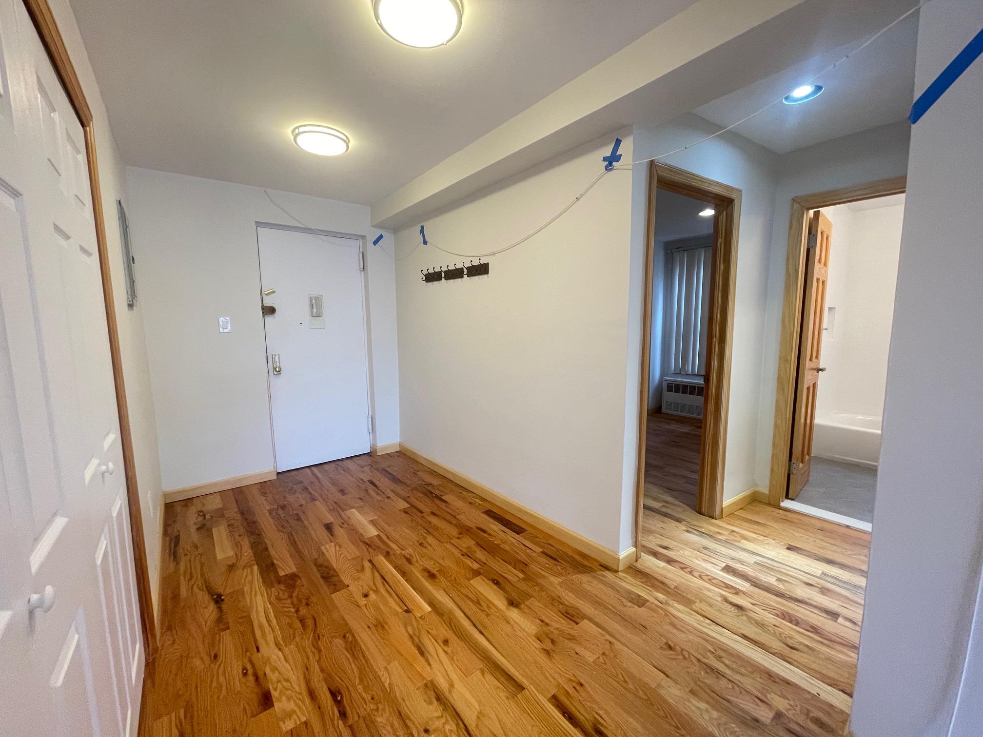 59-30 108th Street, Unit 2JJ Queens, NY 11368 - Photo 10 of 15 Foyer with light wood-type flooring