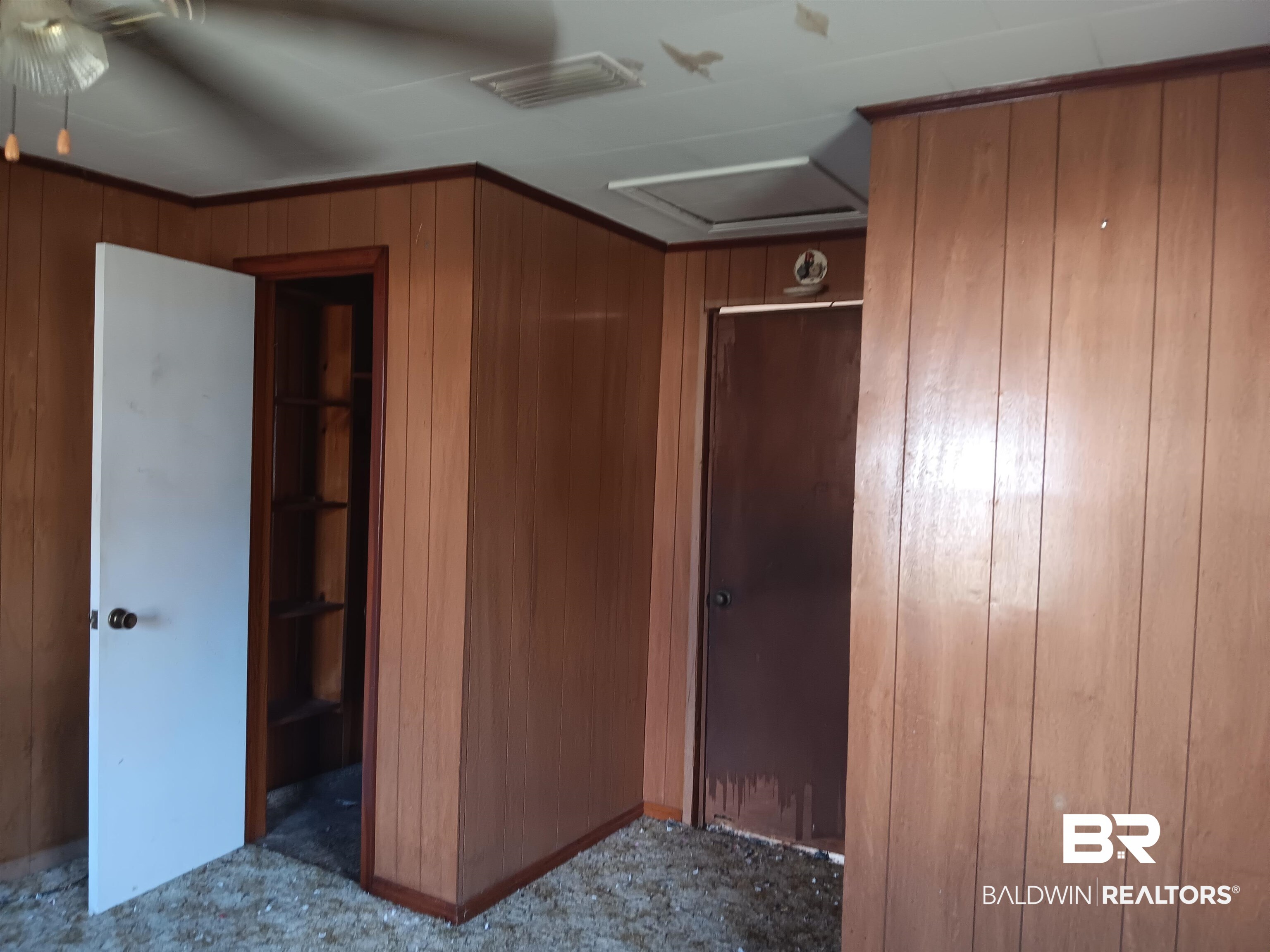 61 Katherine Street Flomaton, AL 36441 - Photo 8 of 13 Unfurnished bedroom with wood walls
