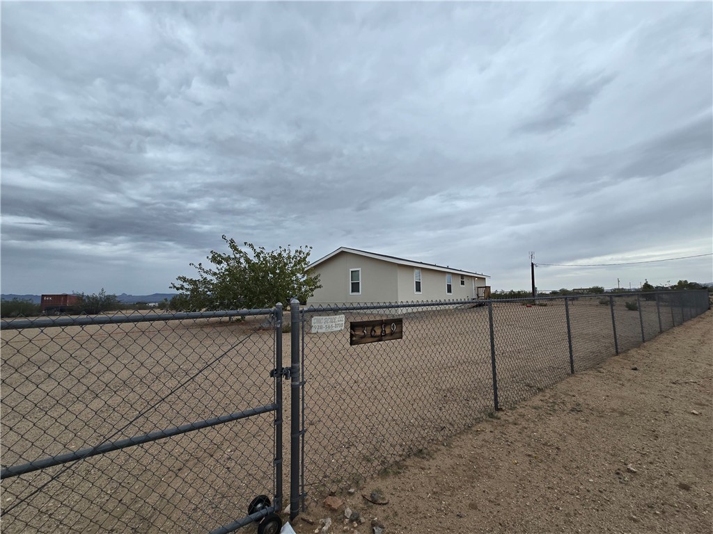 3689 North Avra Road Golden Valley, AZ 86413 - Photo 27 of 32 view from front gate entry