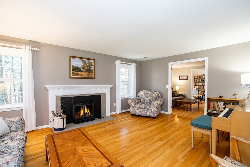 19 Pebble Ridge Road Amherst, MA 01002 - Photo 11 of 42 a living room with furniture and a fireplace