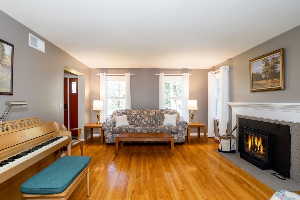 19 Pebble Ridge Road Amherst, MA 01002 - Photo 13 of 42 a living room with furniture and a fireplace