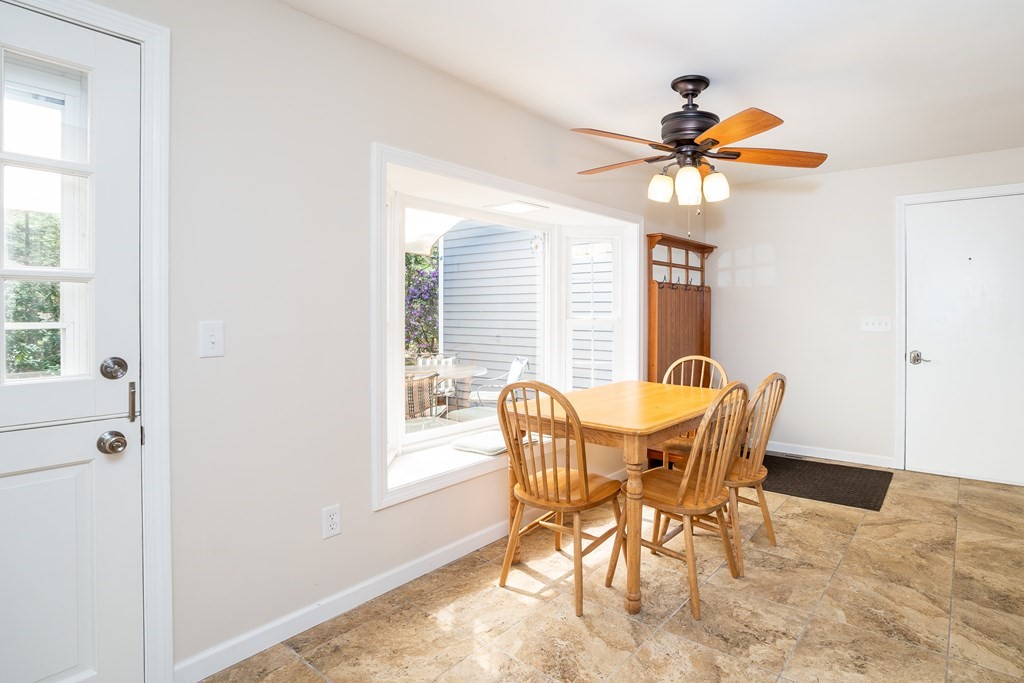 19 Pebble Ridge Road Amherst, MA 01002 - Photo 18 of 42 a view of a dining room with furniture and window