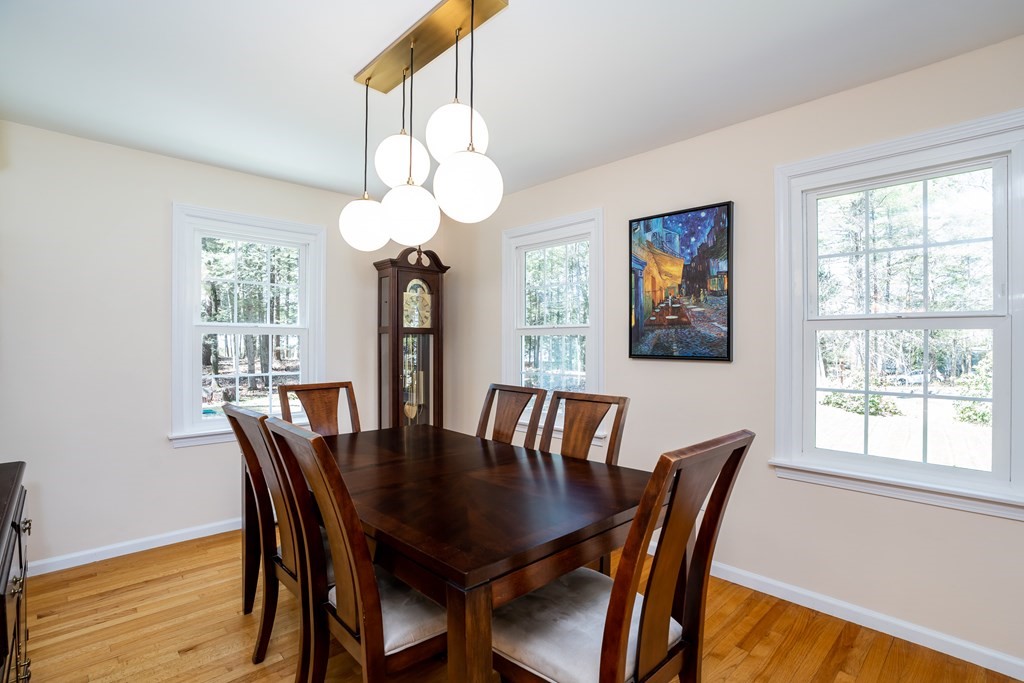 19 Pebble Ridge Road Amherst, MA 01002 - Photo 26 of 42 a view of a dining room with furniture wooden floor and chandelier