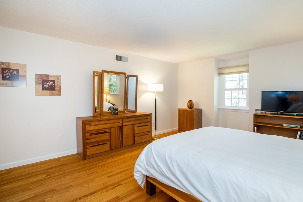 19 Pebble Ridge Road Amherst, MA 01002 - Photo 31 of 42 a bedroom with a bed and a flat screen tv