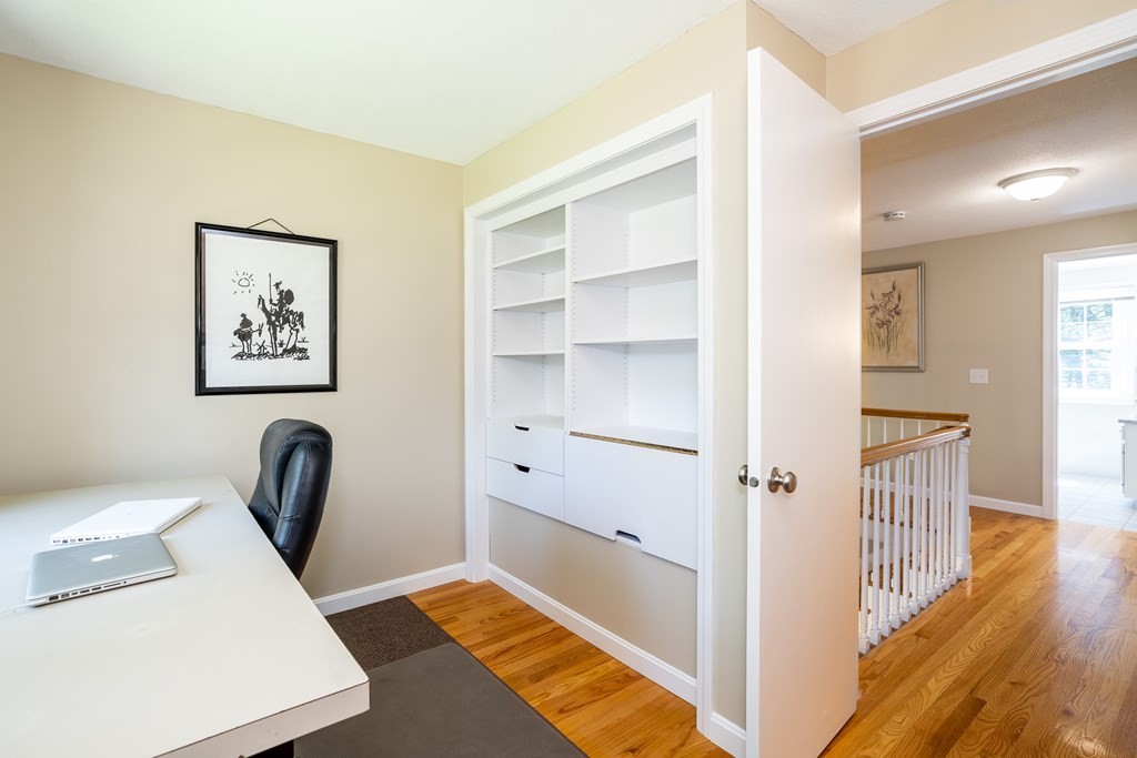 19 Pebble Ridge Road Amherst, MA 01002 - Photo 40 of 42 a view of a hallway with closet and wooden floor