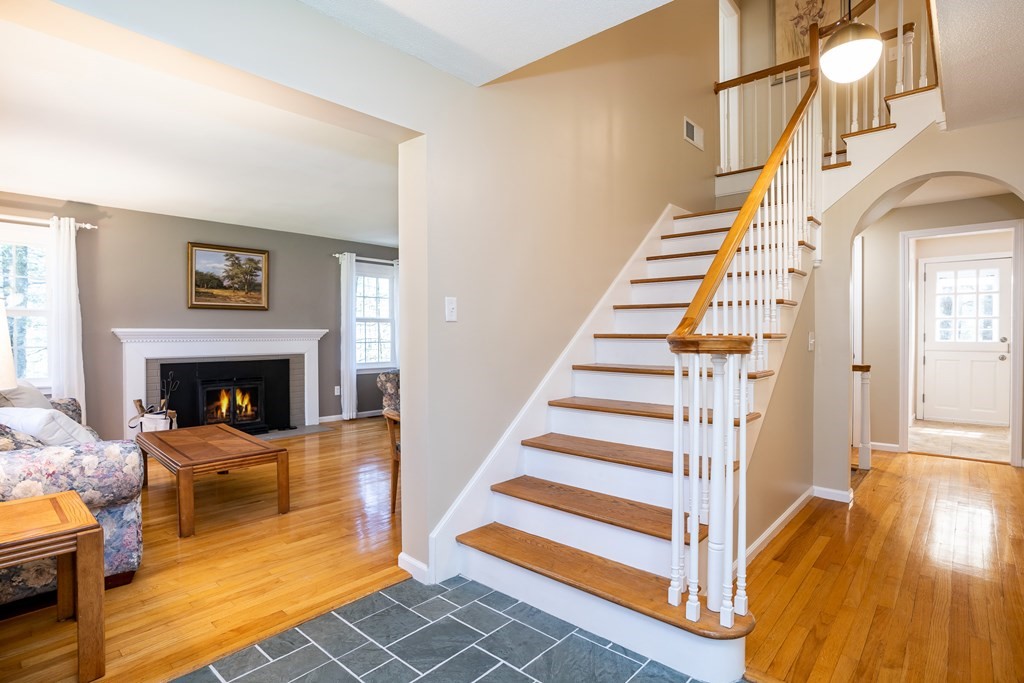 19 Pebble Ridge Road Amherst, MA 01002 - Photo 10 of 42 a living room with furniture and a fireplace