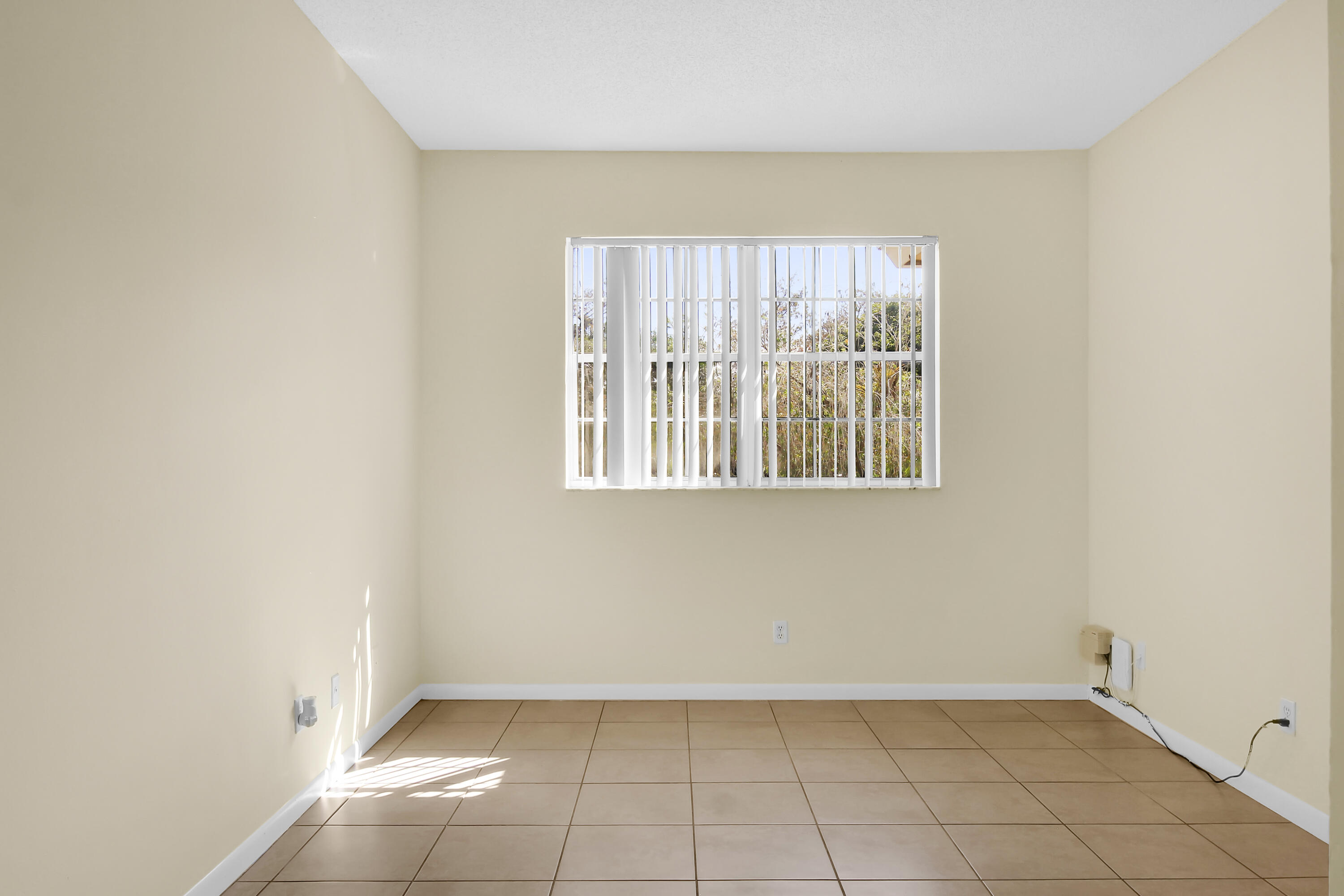 2304 Renaissance Way, Unit 304 Boynton Beach, FL 33426 - Photo 18 of 32 an empty room with windows