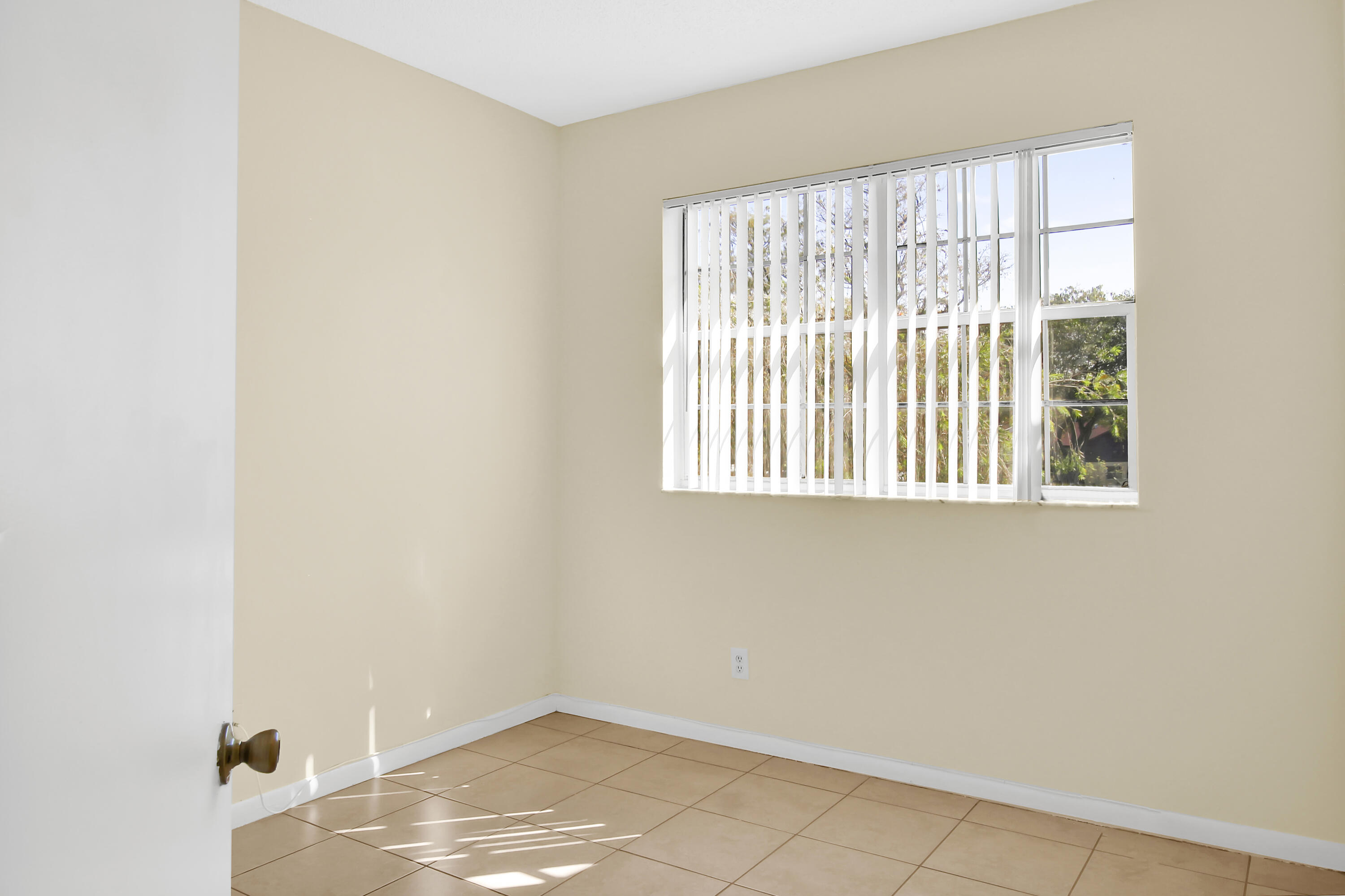 2304 Renaissance Way, Unit 304 Boynton Beach, FL 33426 - Photo 26 of 32 a view of an empty room with a window