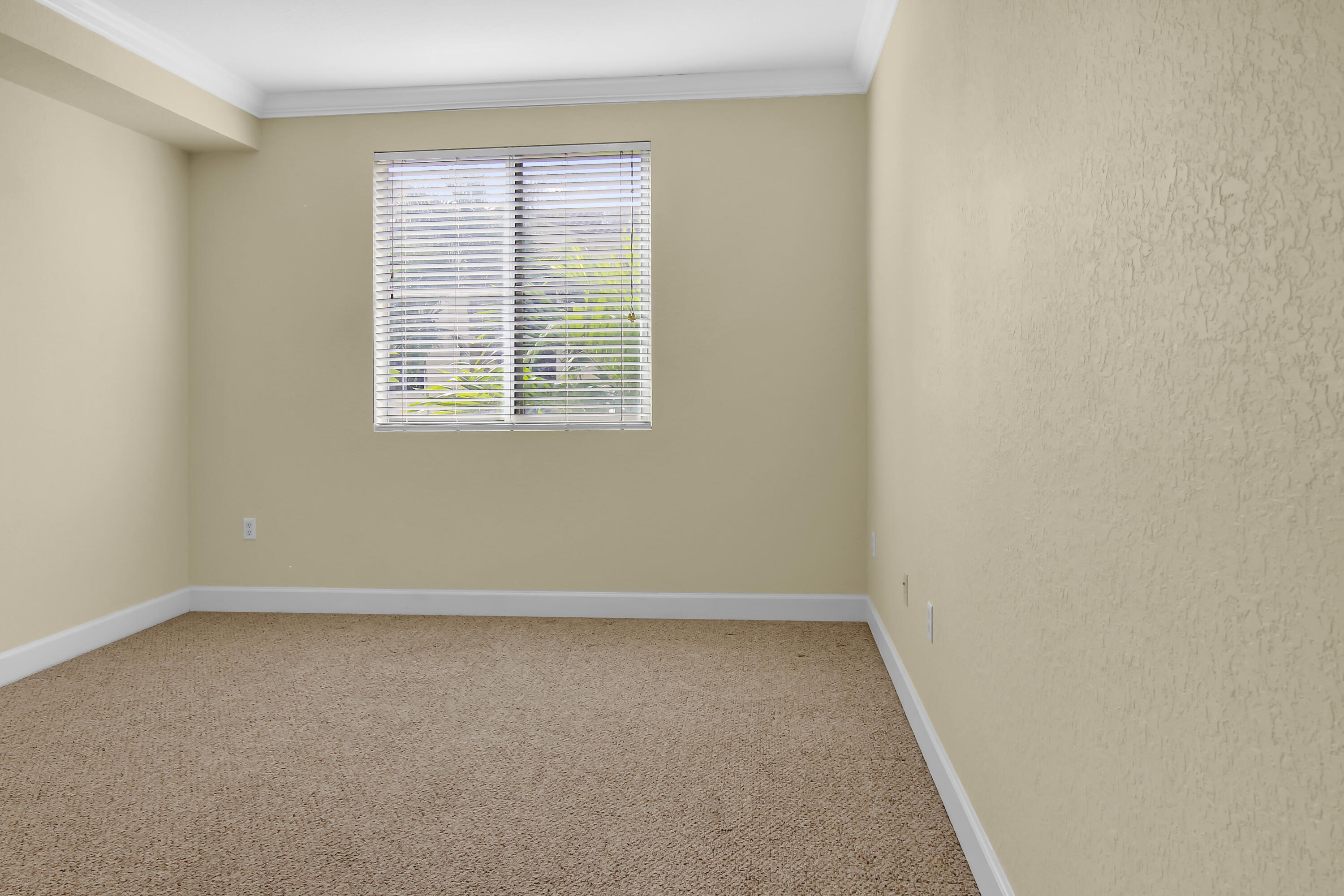 2304 Renaissance Way, Unit 304 Boynton Beach, FL 33426 - Photo 4 of 32 an empty room with a window