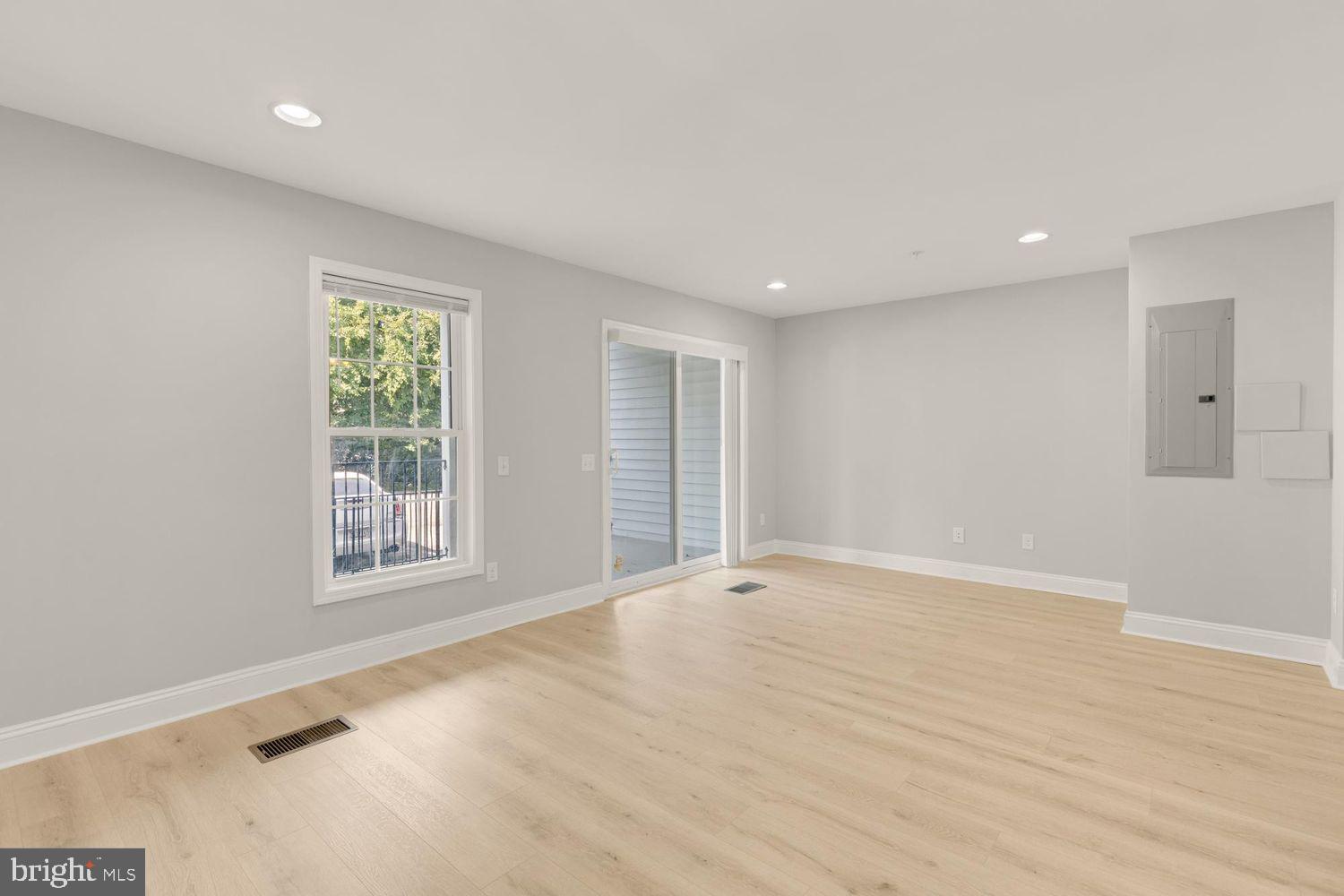 1755 W Street Southeast, Unit A Washington, DC 20020 - Photo 23 of 35 a view of an empty room with wooden floor and a window