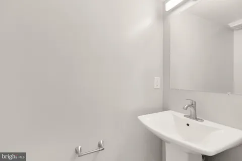 a bathroom with a sink and mirror