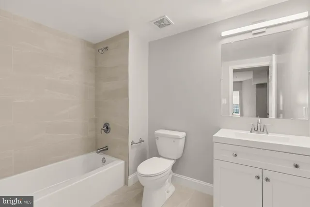 a bathroom with a sink toilet and bathtub