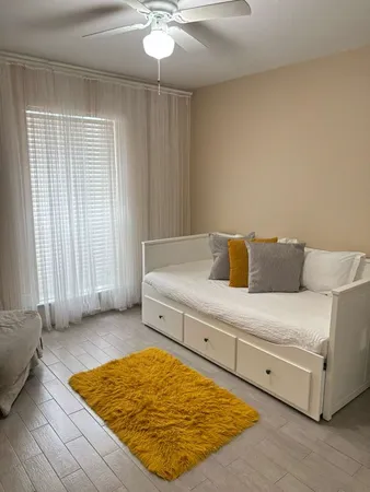 a front view of a house with a garden