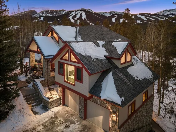 aerial view of a house with a yard