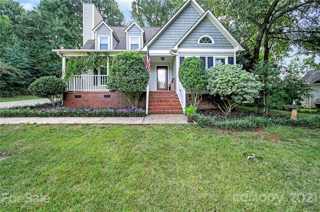 963 Pine Knoll Road Fort Mill, SC 29715 - Photo 1 of 23 a front view of a house with a yard and potted plants