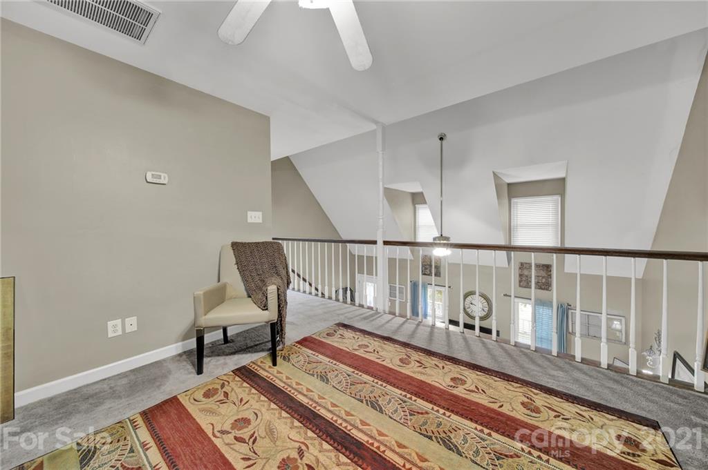 963 Pine Knoll Road Fort Mill, SC 29715 - Photo 14 of 23 a view of a hallway with wooden floor and a potted plant