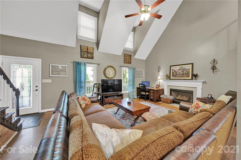 963 Pine Knoll Road Fort Mill, SC 29715 - Photo 3 of 23 a living room with fireplace furniture and a flat screen tv