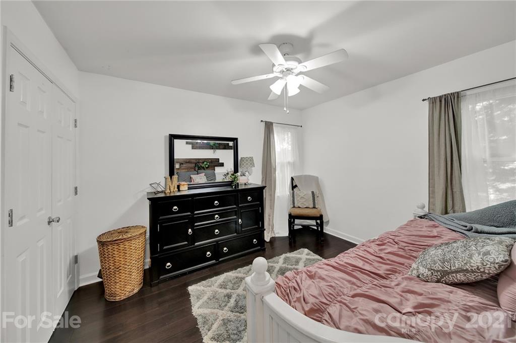 963 Pine Knoll Road Fort Mill, SC 29715 - Photo 9 of 23 a bedroom with a bed and wooden floor