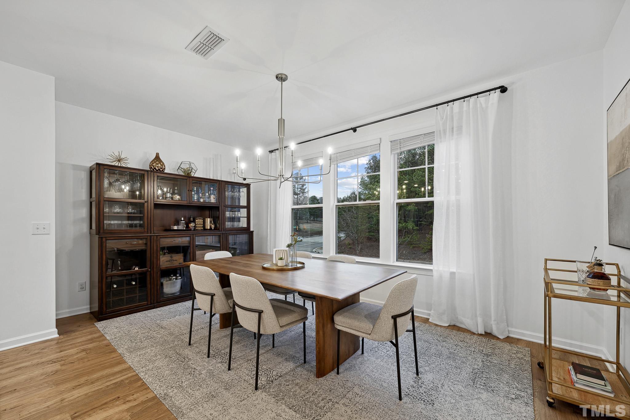 3251 Lynn Road Raleigh, NC 27613 - Photo 17 of 29 a view of a dining room with furniture